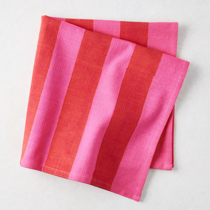 Folded Pink and Red Tonal Hampton Stripe Cotton Napkin, 22" square.