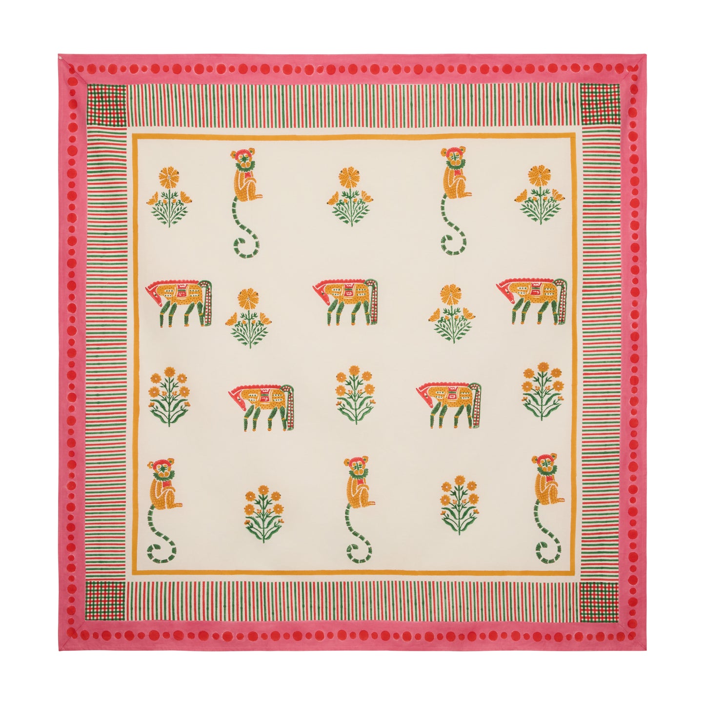 Pink block print cotton tablecloth with floral, horse, and monkey motifs, trimmed with a pink and multicolored edge.