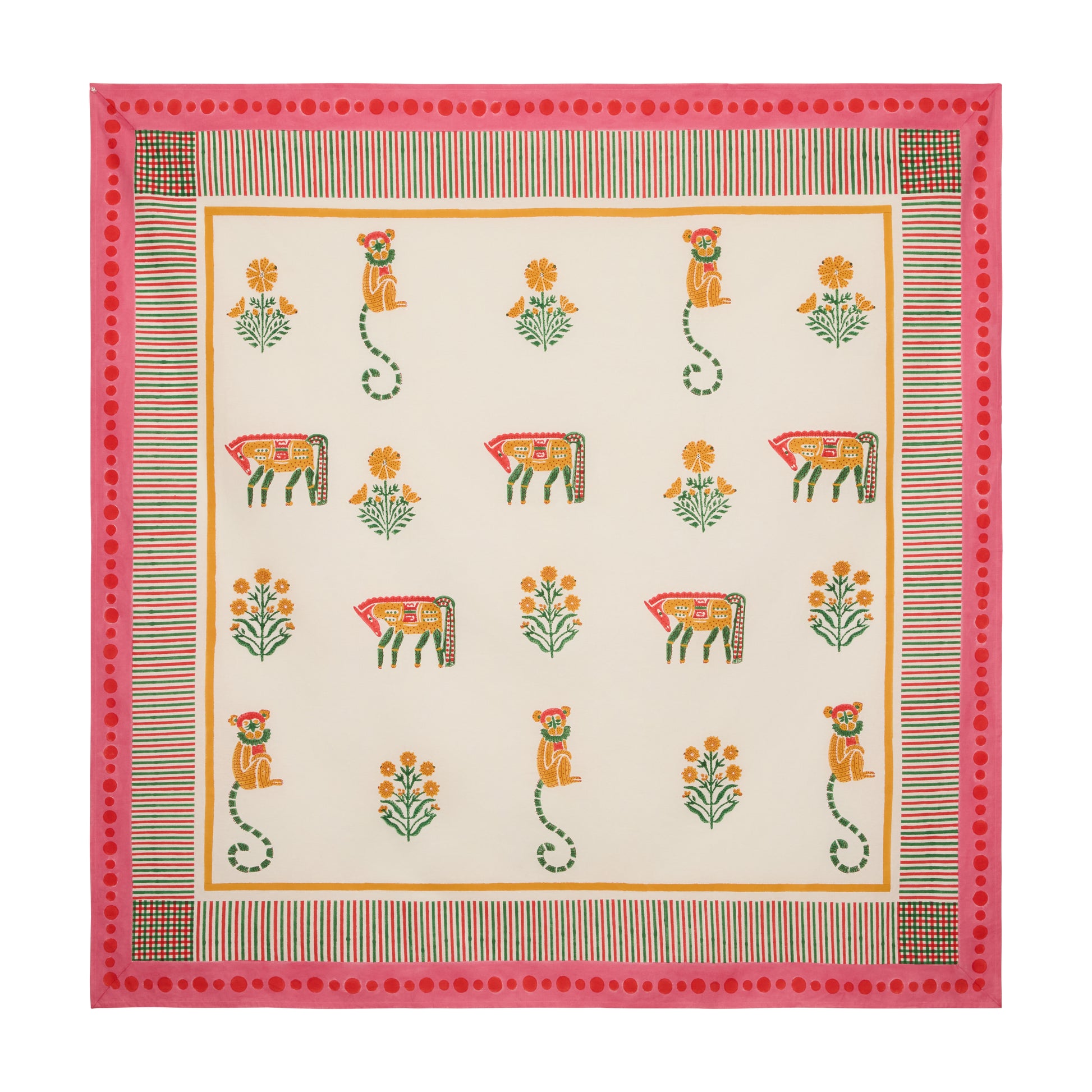 Pink block print cotton tablecloth with floral, horse, and monkey motifs, trimmed with a pink and multicolored edge.
