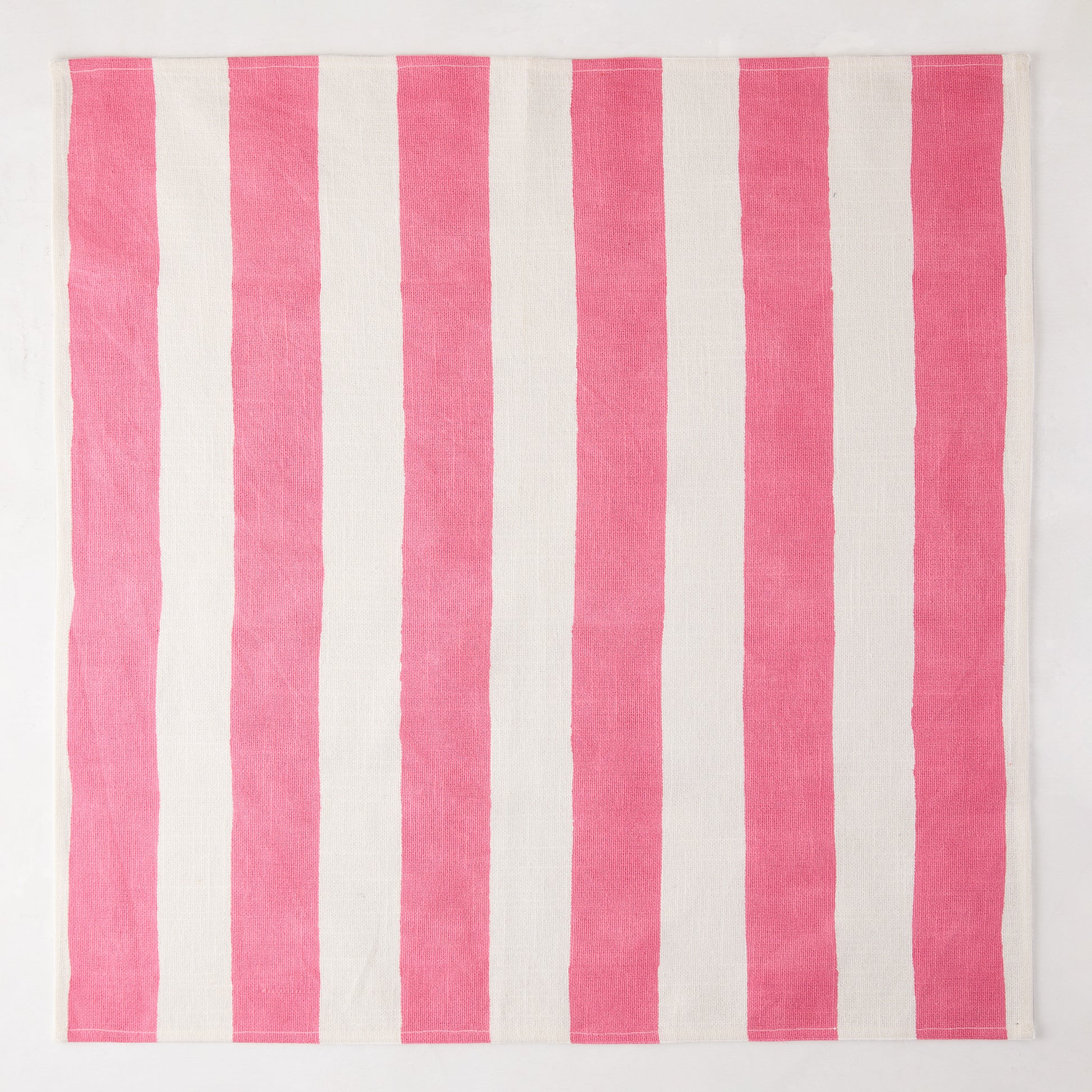 Pink Hampton Stripe Cotton Napkin, 22" square, with bold pink and white vertical stripes.