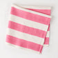 Folded Pink Hampton Stripe Cotton Napkin, 22" square, with bold pink and white stripes.