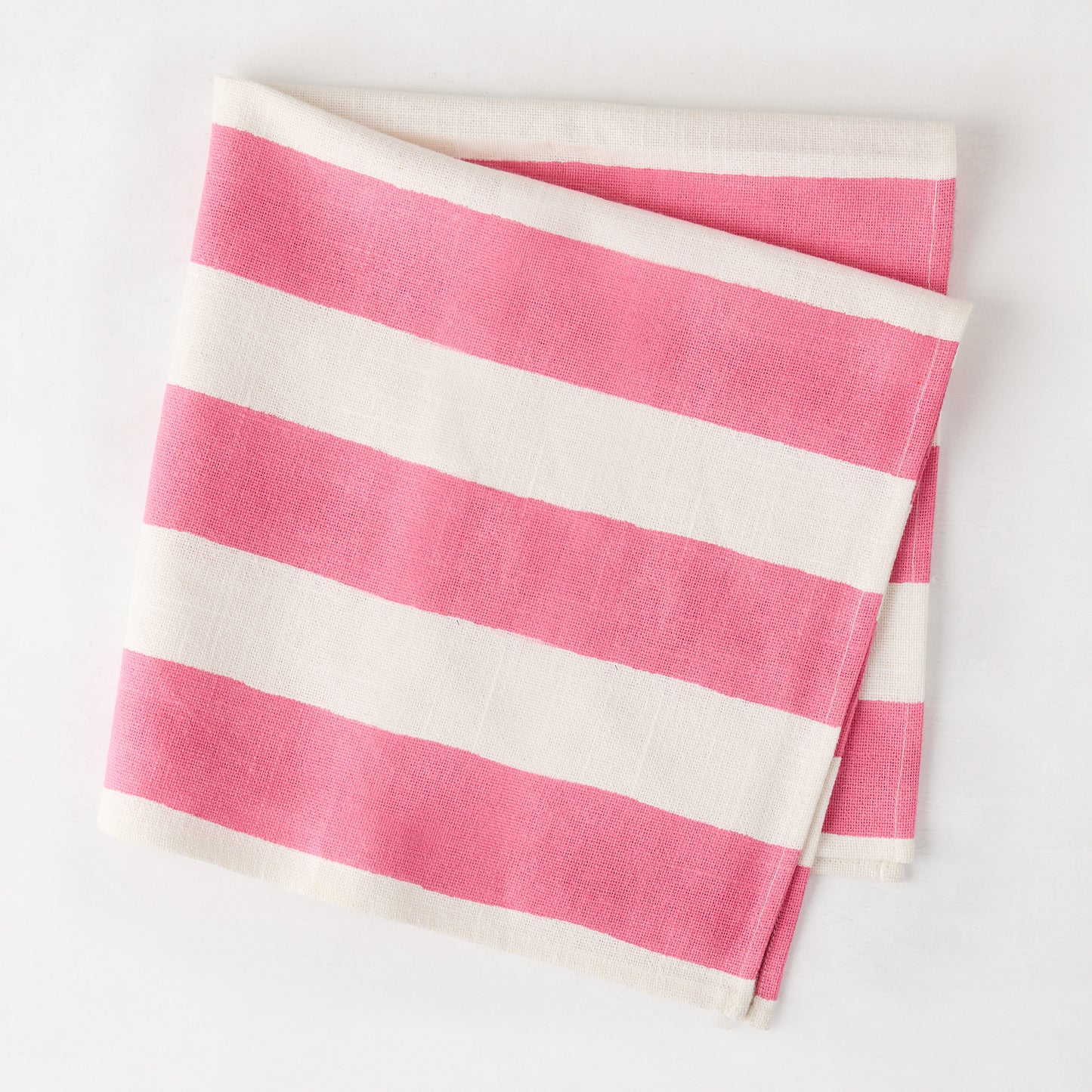 Folded Pink Hampton Stripe Cotton Napkin, 22" square, with bold pink and white stripes.