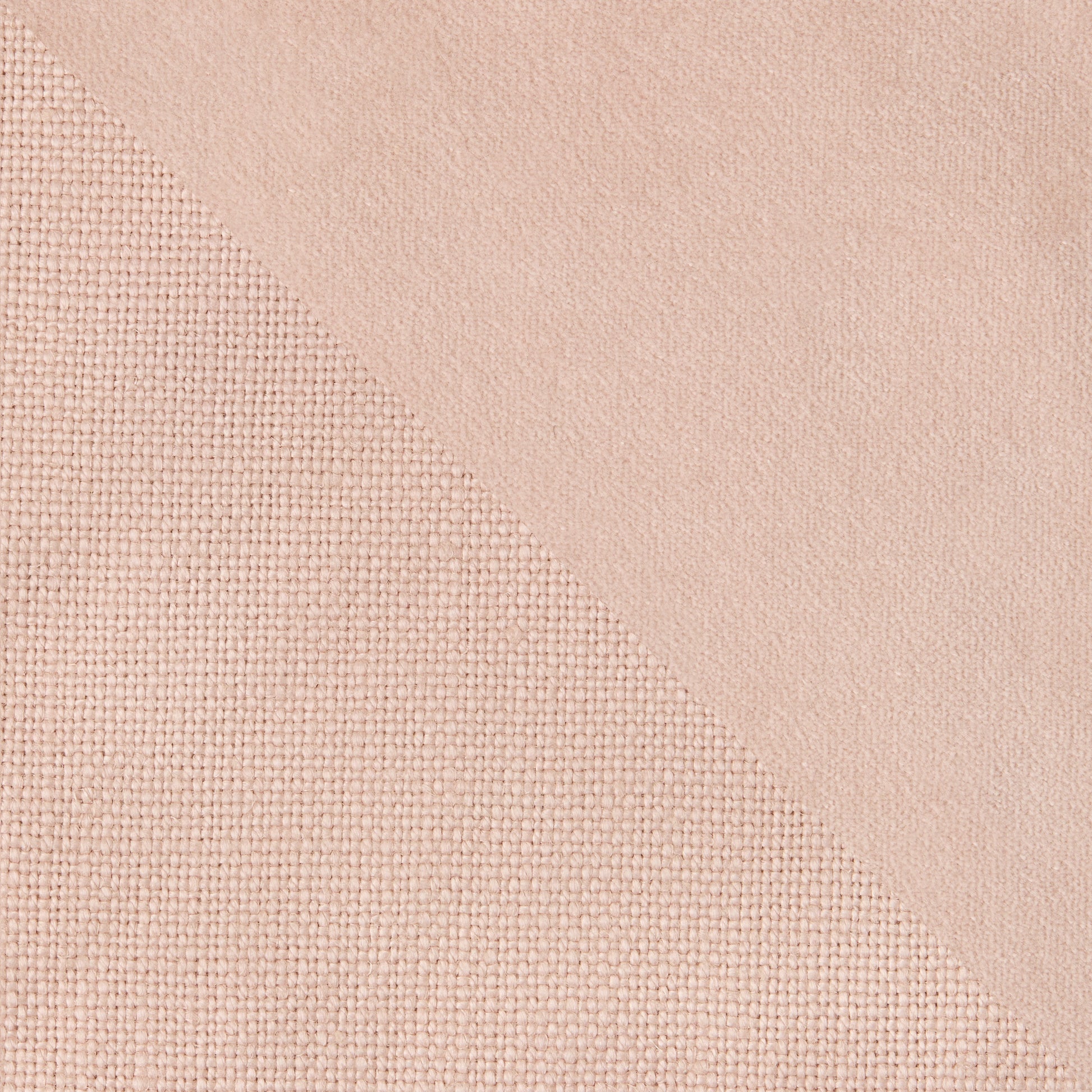 Pink linen and velvet reversible pillow, 22" square, with visible fabric textures.