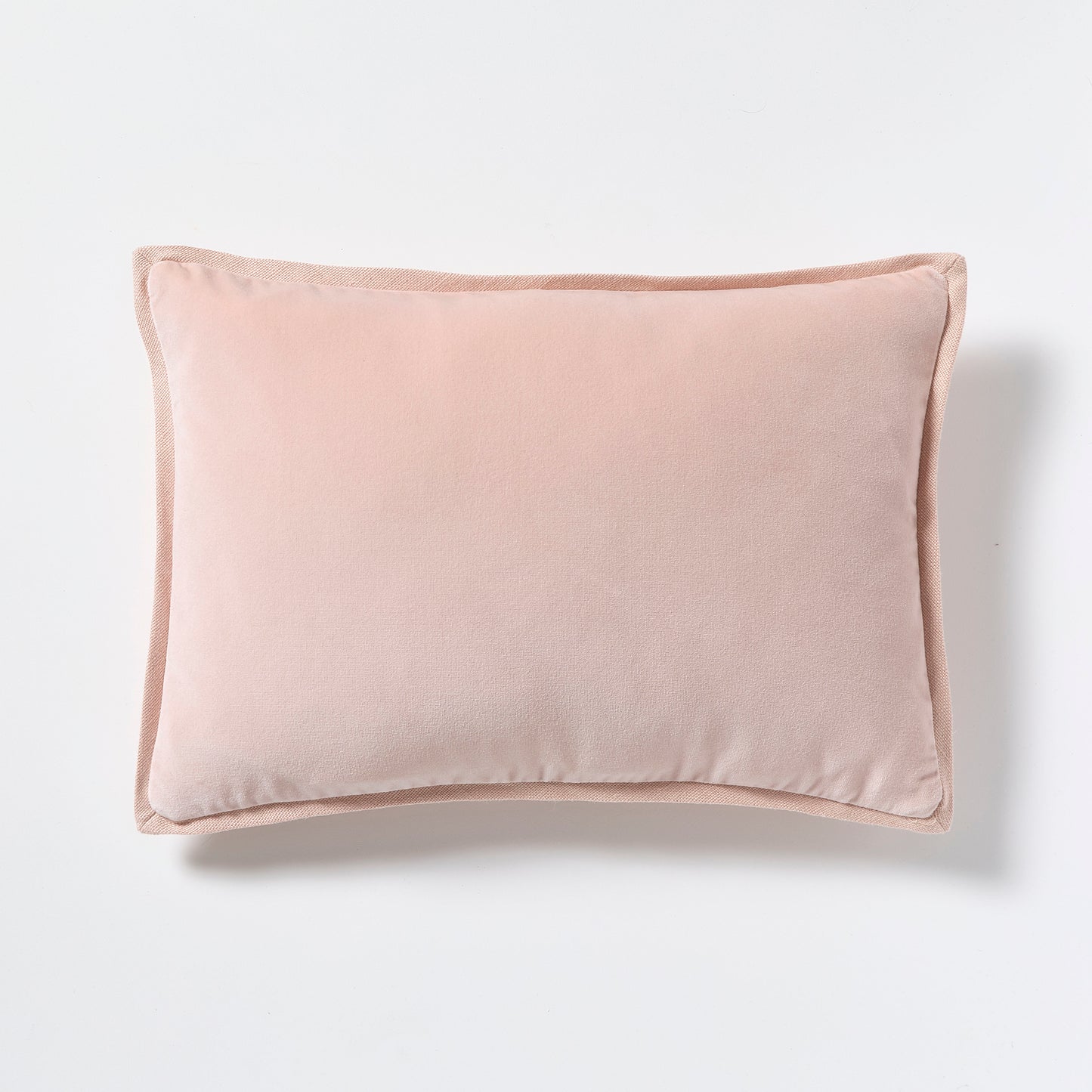 Pink linen and velvet reversible lumbar pillow, 20"L x 14"H, with hidden zipper and down insert.