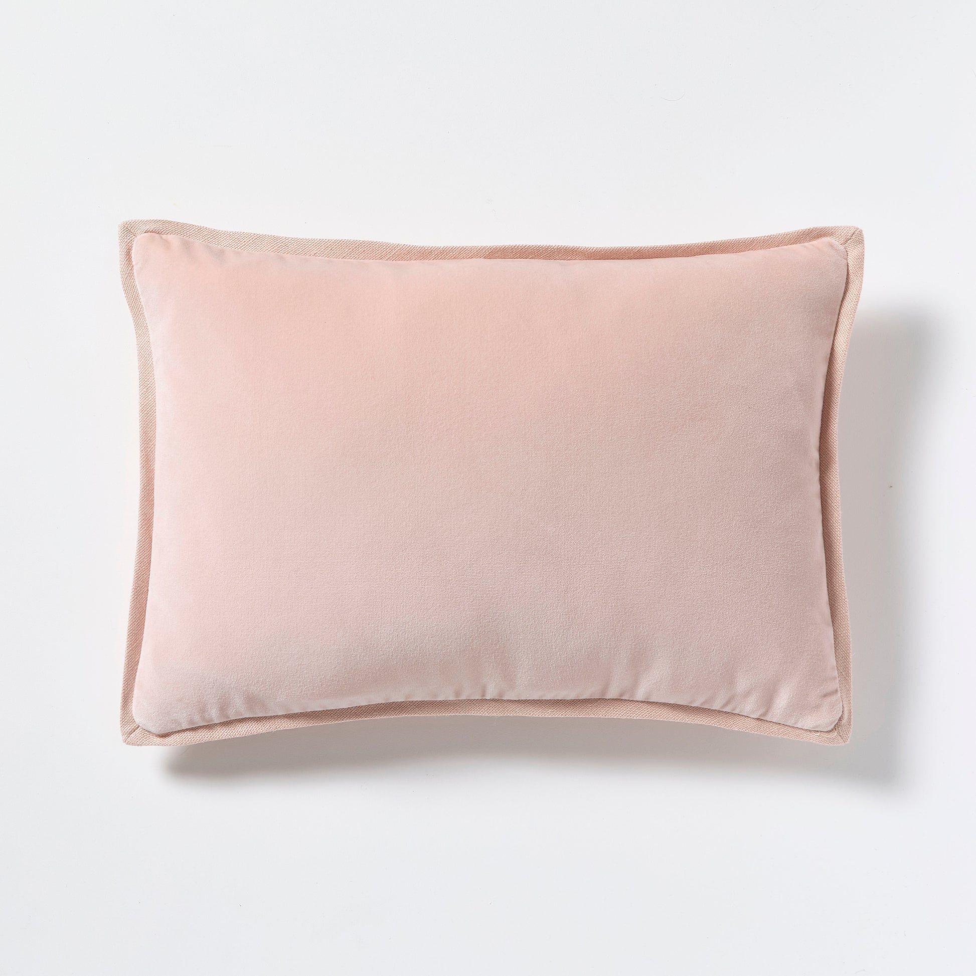 Pink linen and velvet reversible lumbar pillow, 20"L x 14"H, with hidden zipper and down insert.