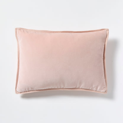 Pink linen and velvet reversible lumbar pillow, 20"L x 14"H, with hidden zipper and down insert.