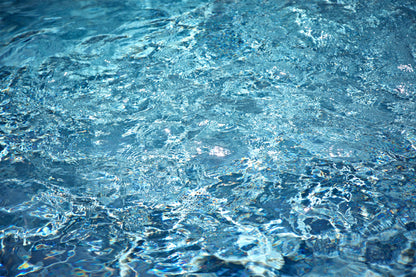 Matt Albiani's "Pool Details" photograph, capturing shimmering blue water with light reflections.