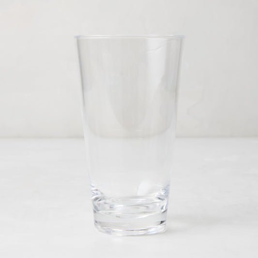 Clear acrylic high ball glass, 19oz, with a sturdy bottom and smooth lip.