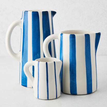 Portofino Blue Stripe Large Ceramic Pitcher, white with hand-painted blue vertical stripes, curved handle and spout.