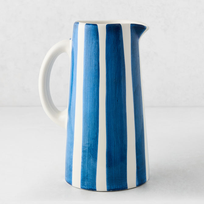 Portofino Blue Stripe Large Ceramic Pitcher, white glaze with hand-painted blue vertical stripes, curved handle.