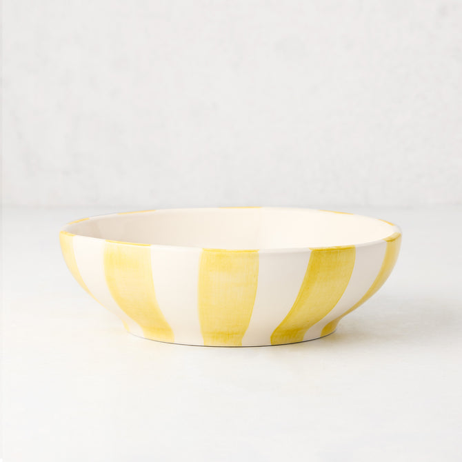 Portofino Yellow Stripe Ceramic Stoneware Bowl, hand-painted thick yellow vertical stripes on a white background.