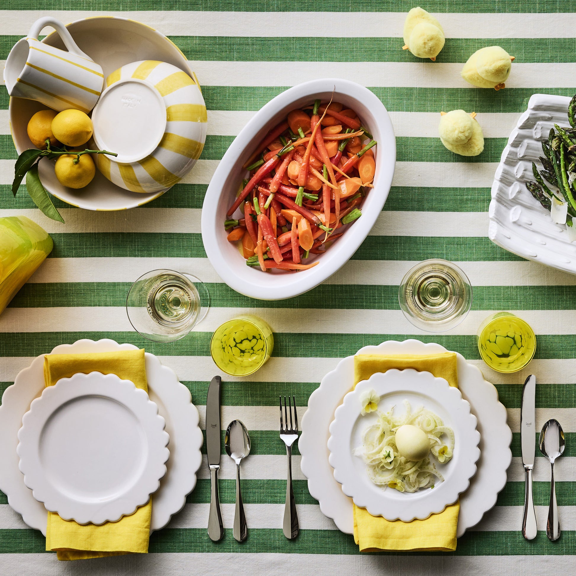 Portofino Yellow Stripe Large Ceramic Serve Bowl with hand-painted yellow stripes, filled with salad.