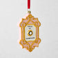 Pink and gold Press for Champagne glass Christmas ornament with a red ribbon hanger.