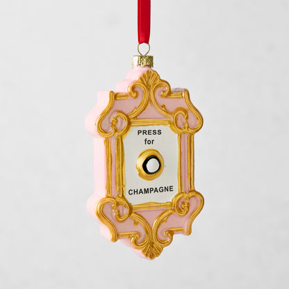Pink and gold Press for Champagne glass Christmas ornament with a red ribbon hanger.