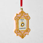 Pink and gold Press for Champagne glass Christmas ornament with a red ribbon hanger.