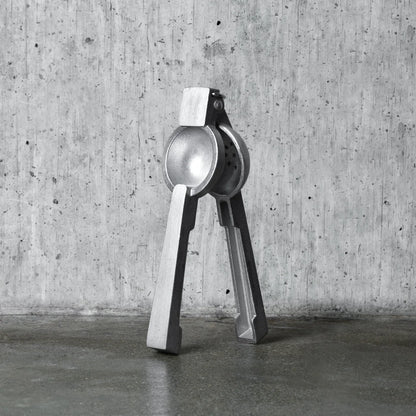 Professional silver aluminum citrus juicer, 9''H x 3''W, with polished finish.
