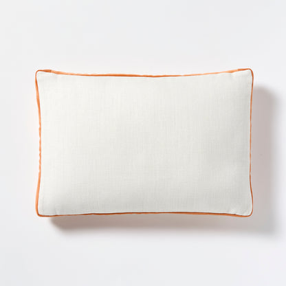 White linen lumbar pillow with pumpkin orange velvet gusset, 20x14 inches.