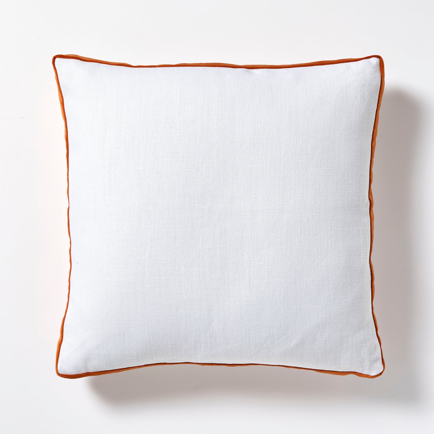 White Belgian Linen 22" square pillow with pumpkin orange velvet gusseted trim.
