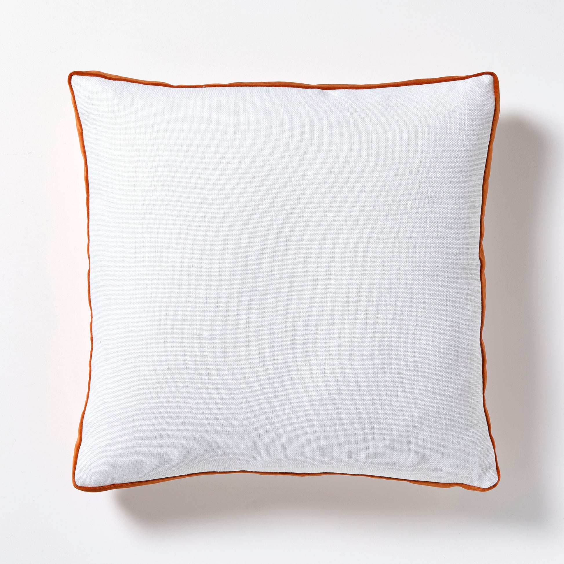 White Belgian Linen 22" square pillow with pumpkin orange velvet gusseted trim.