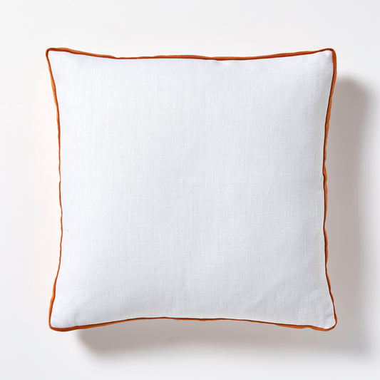 White Belgian Linen 22" square pillow with pumpkin orange velvet gusseted trim.