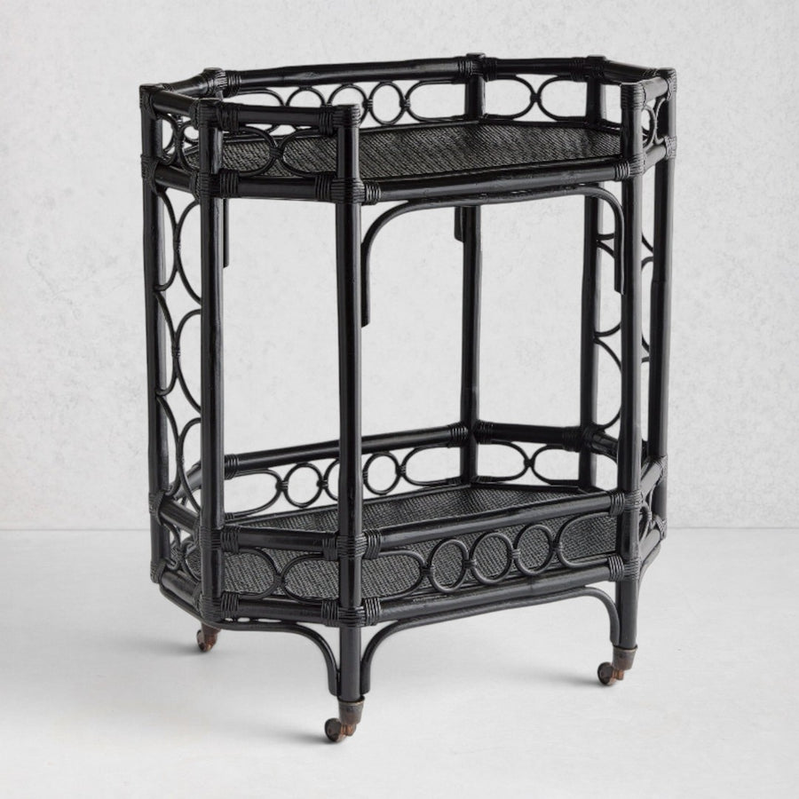 Raelyn Black Rattan Bar Cart with two shelves, dark wood, and smooth-rolling casters.