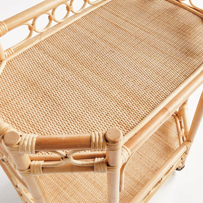 Natural rattan Raelyn Bar Cart with woven shelves and dark wood accents.