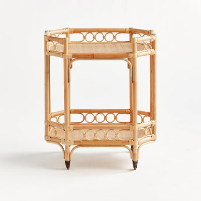Natural Raelyn Bar Cart with handmade rattan frame, dark wood shelves, and smooth-rolling casters.