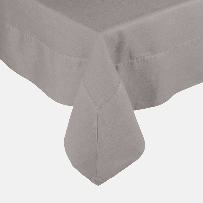 Rain HG Signature hand-dyed linen tablecloth in a soft grey, featuring a generous border and mitered corner.