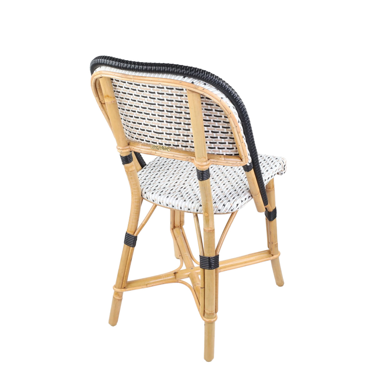 Rattan Chambord Bistro Chair, black and white polka dot woven rattan, natural wood frame, black border.