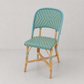 Rattan Chambord Bistro Chair with blue and green woven chevron pattern and natural wood frame.