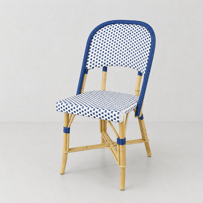 Rattan Chambord Blue Polka Dot Bistro Chair with blue and white woven rattan and a natural wooden frame.
