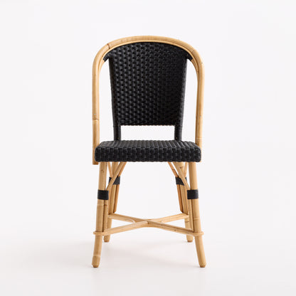 Black woven rattan bistro chair with a natural wooden frame and curved backrest on a white background.