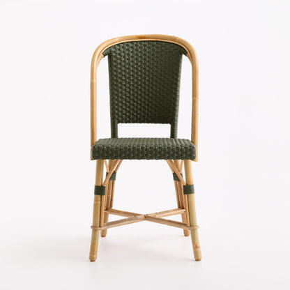 Olive green woven rattan bistro chair with a natural wooden frame and classic Parisian cafe design.