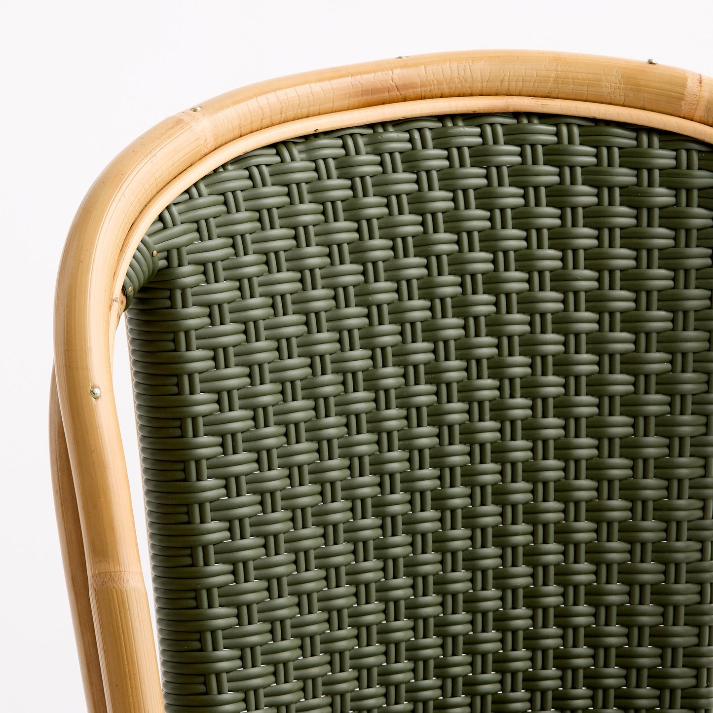 Olive green woven rattan bistro chair back with a natural light wood frame.