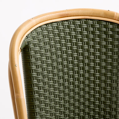 Olive green woven rattan bistro chair back with a natural light wood frame.