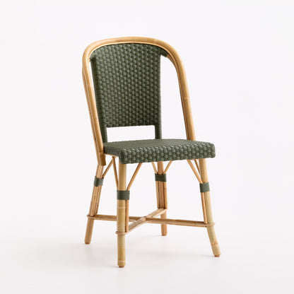 Olive green woven rattan bistro chair with a light wood frame and classic Parisian cafe design.