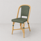 Rattan Fouquets Olive Green Bistro Chair with woven rattan seat and back, and natural wooden frame.
