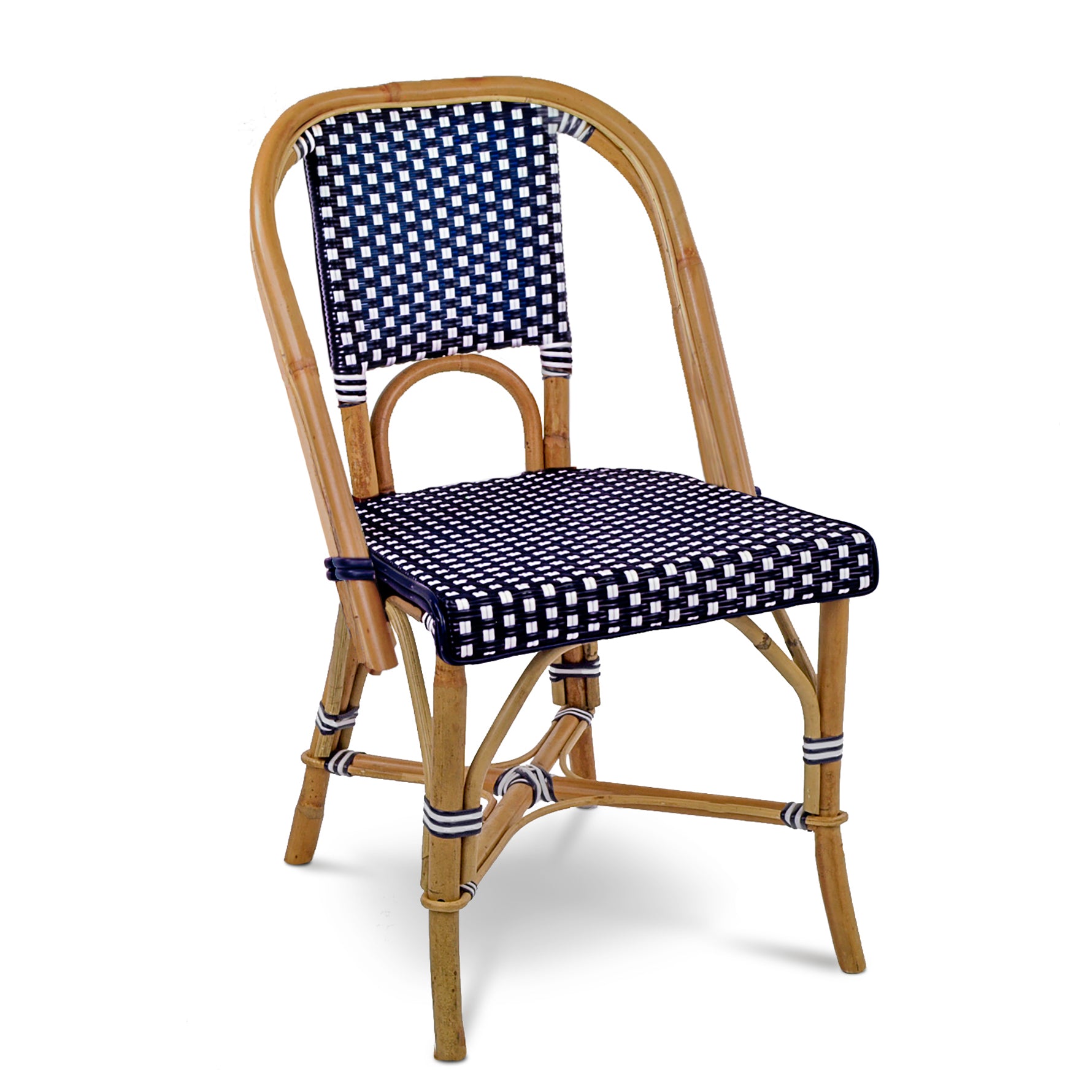 Rattan bistro chair with navy blue and white spotted woven seat and back.