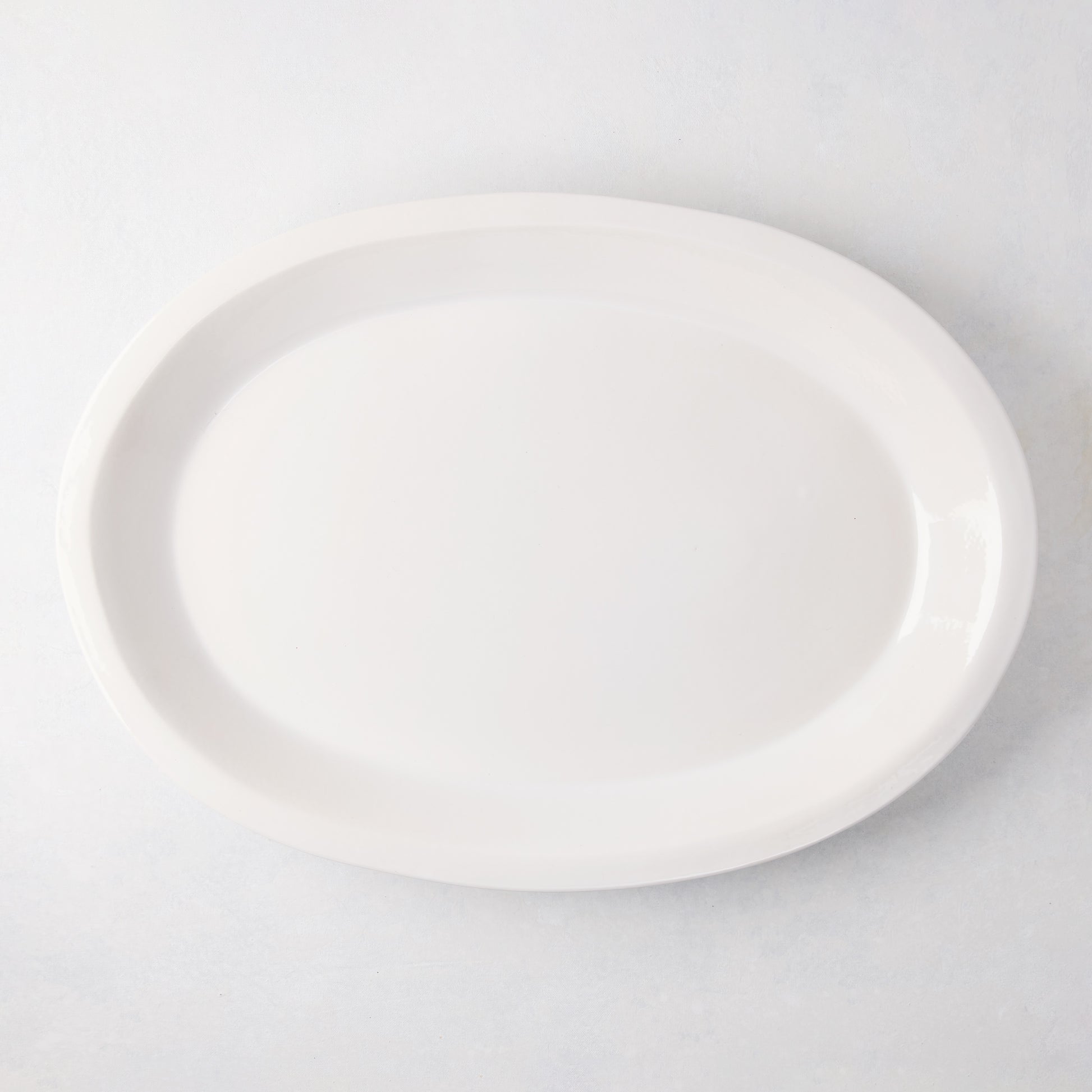 Ravello Large Oval Stoneware Serving Platter, white glaze, 21"L x 15.2"W, raised edge.