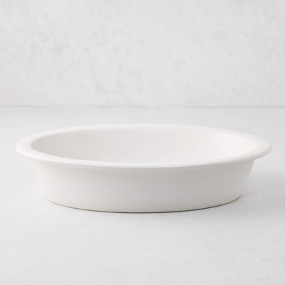 White Ravello stoneware oval baking dish with an oversized lip.