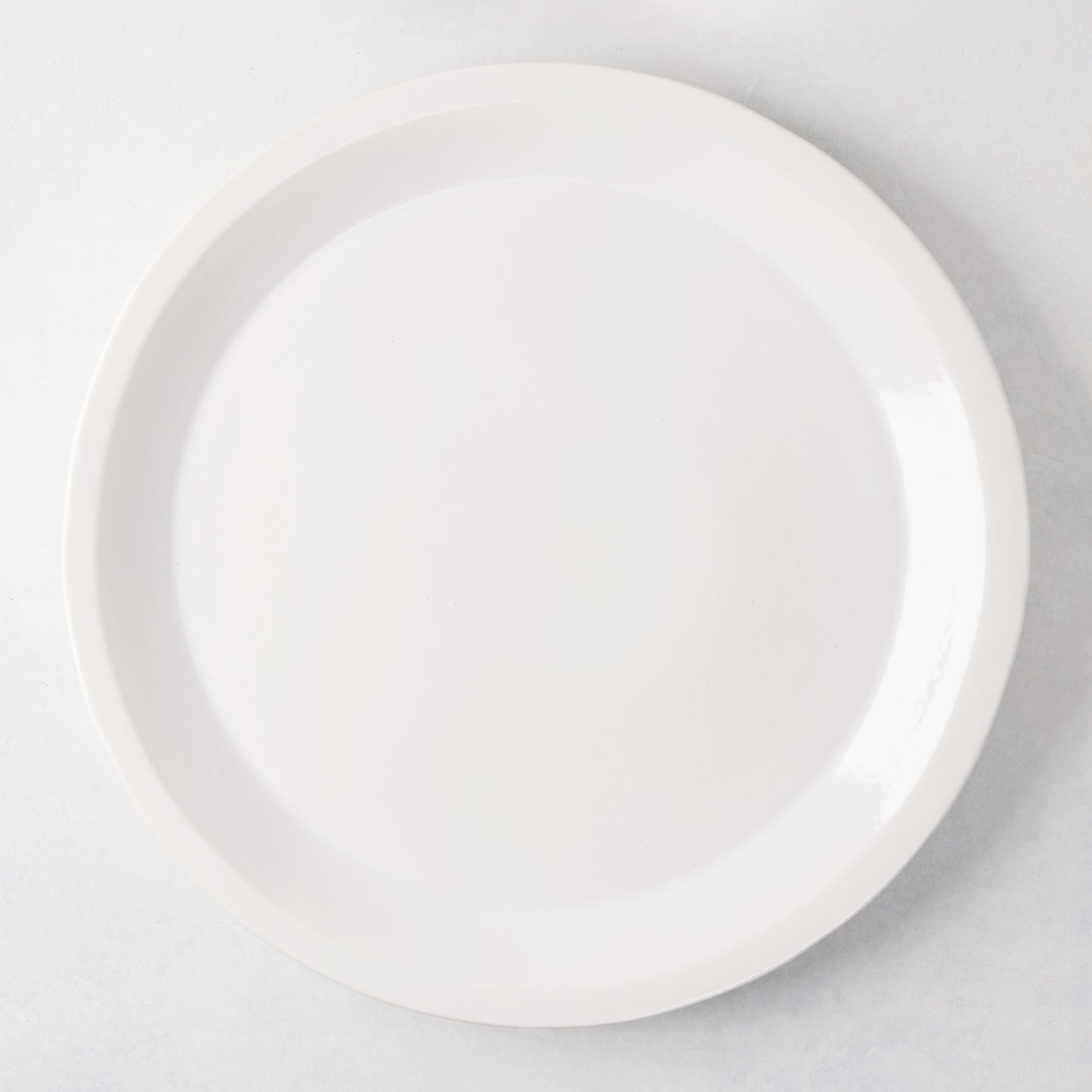 Ravello Round Stoneware Serving Platter, 15.75"Dia, white glaze, raised edge.