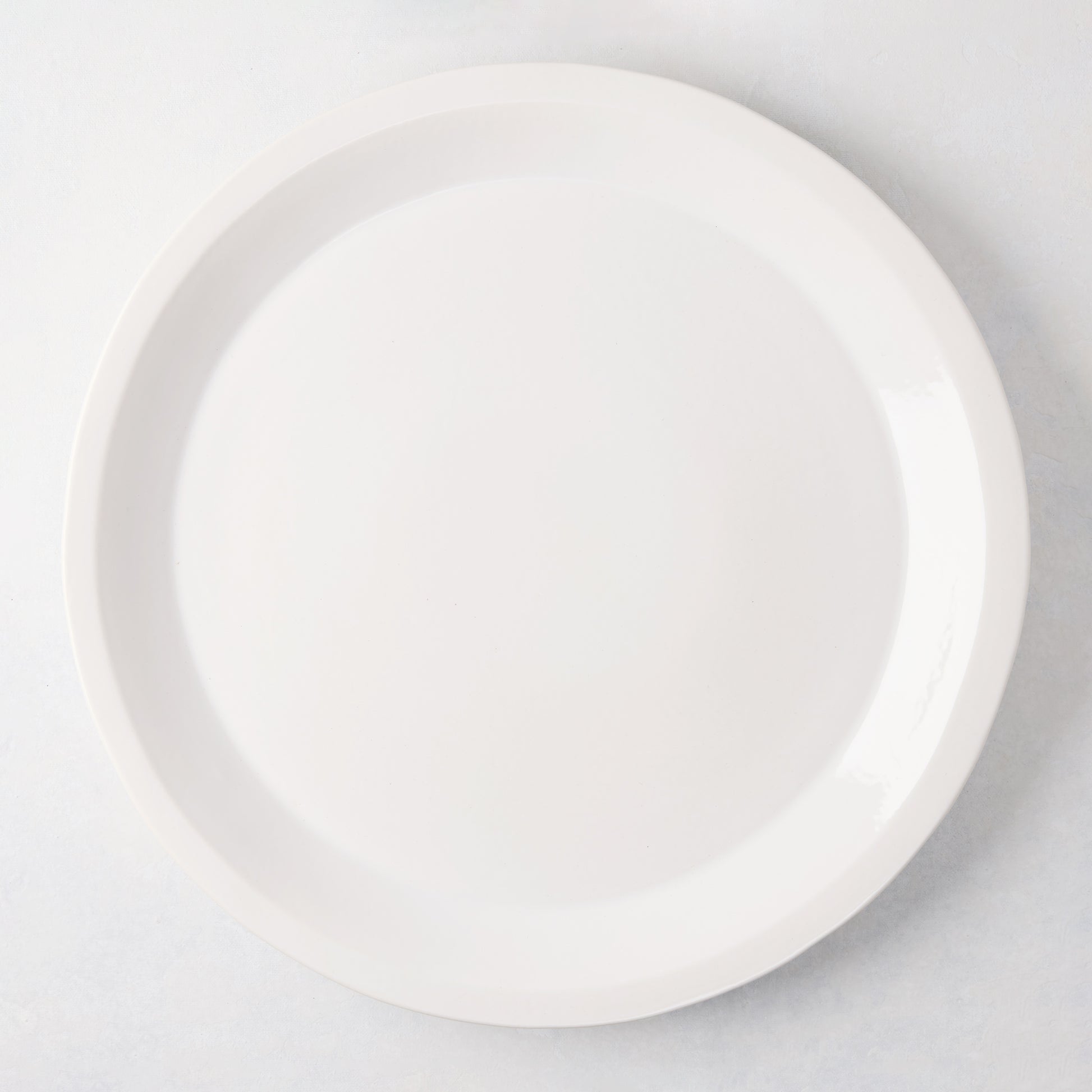 Ravello Round Stoneware Serving Platter, 15.75"Dia, white glaze, raised edge.