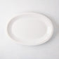White Ravello Small Oval Stoneware Serving Platter with raised edge, 18.3"L x 12.8"W.