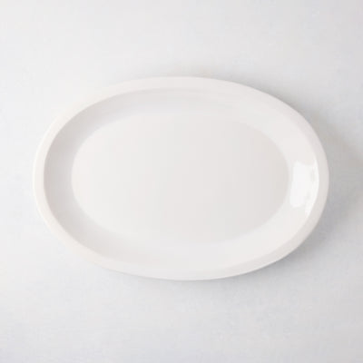 White Ravello Small Oval Stoneware Serving Platter with raised edge, 18.3"L x 12.8"W.