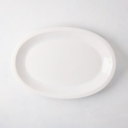 White Ravello Small Oval Stoneware Serving Platter with raised edge, 18.3"L x 12.8"W.