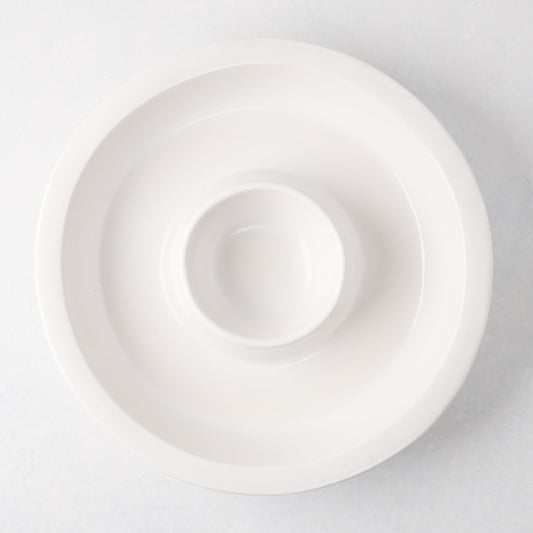 Ravello white stoneware chip and dip platter with built-in dipping bowl, 13" diameter.