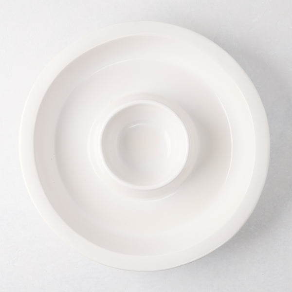 Ravello white stoneware chip and dip platter with built-in dipping bowl, 13" diameter.