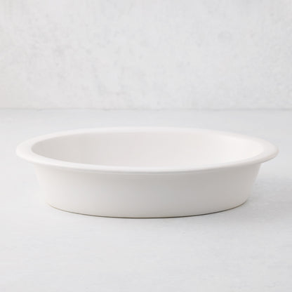 White Ravello stoneware oval baking dish with an oversized lip.