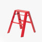 Red Lucano Hasegawa 2-step lightweight aluminum and steel ladder with matte finish and grooved treads.