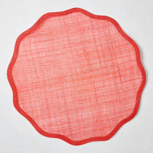 16-inch round red abaca fiber placemat with a tonal scalloped edge and semi-transparent woven texture.